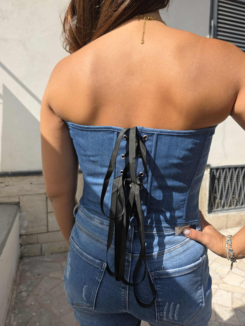 Bustino in denim con lacci intrecciato posterire